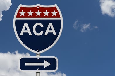 A photo of a road sign indicating that the ACA is to the right.
