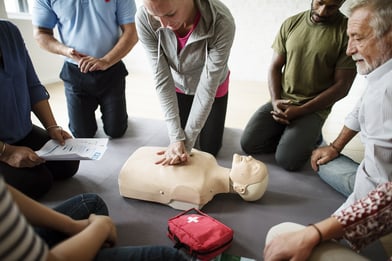 A photo of a a CPR demonstration as part of a wellness program.