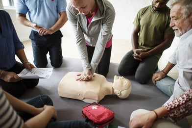 A photo of a a CPR demonstration as part of a wellness program.