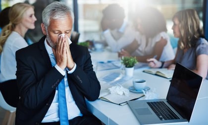 Sick and contagious employee at work