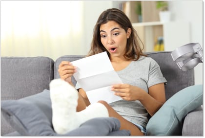 Surprised disabled woman reading a medical bill