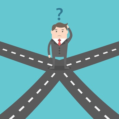 A cartoon image of a man at a crossroads, trying to make a decision of which way to go.