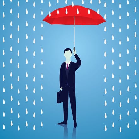 A cartoon image of a man holding an umbrella up to protect himself from rain.