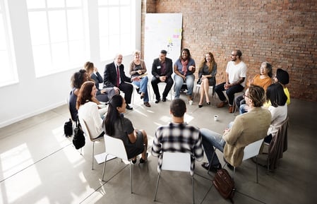 A photo of a small group session for workplace harassment training.