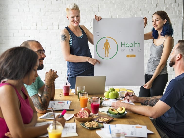 A photo of a wellness presentation at an employee meeting.