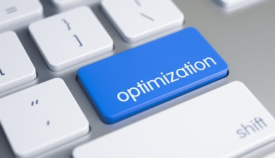 A close-up image of a computer keyboard with a key labeled "optimization" in focus.