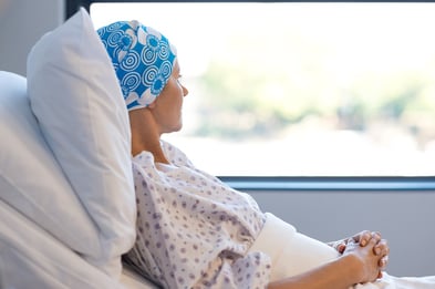 A photo of a cancer patient resting in her hospital room.