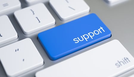 A close-up image of a computer keyboard with a key labeled "support" in focus.