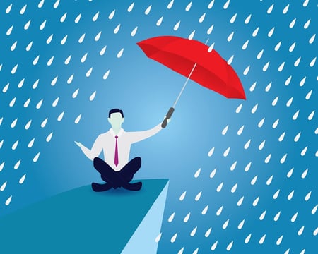 A cartoon image of a man holding an umbrella up to protect himself from rain.